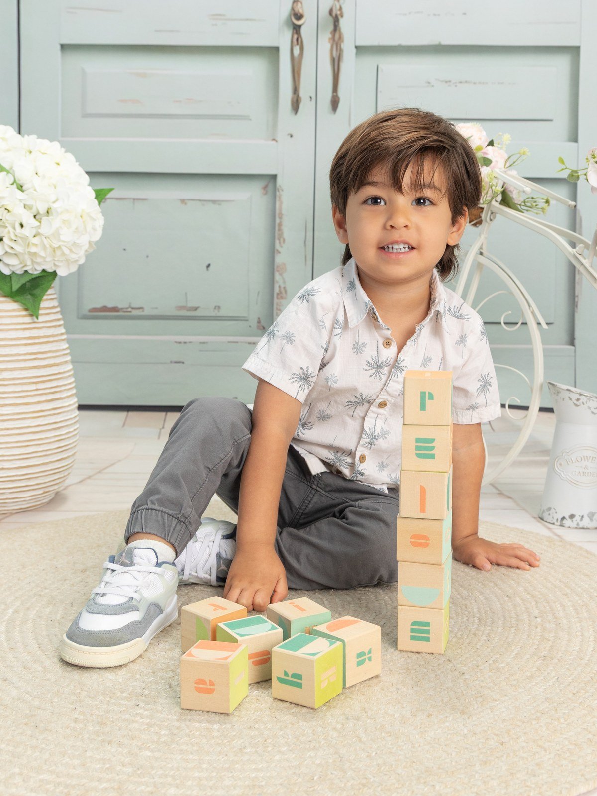Boy playing with wooden blocks portrait
